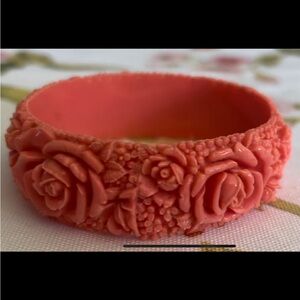 Vintage celluloid bracelet carved flowers peachy orange color ornate antique.